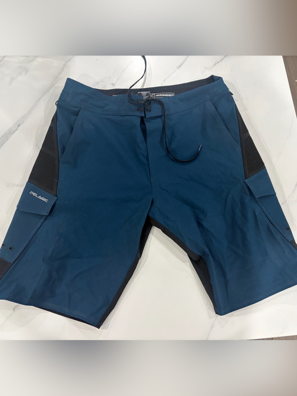 Pelagic Men's Teal Athletic Board Shorts